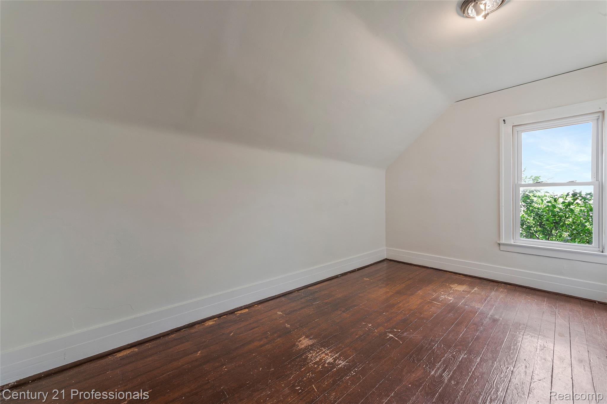 238 Richter Street River Rouge, MI 48218 - Photo 20 of 33 Attic room featuring a single window, sloped ceilings, and wood-finish flooring