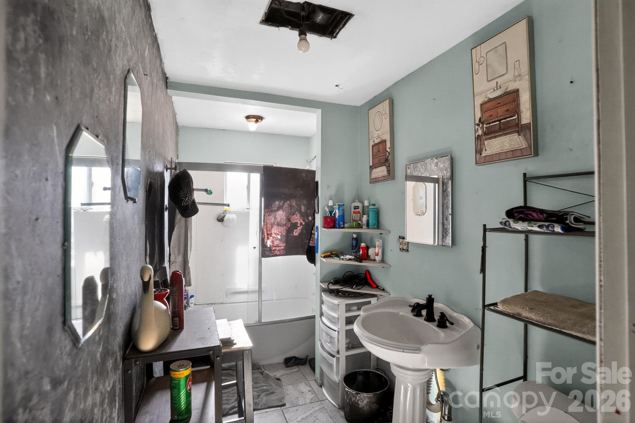 1124 Walshtown Road Boomer, NC 28606 - Photo 11 of 15 a bathroom with a sink and a mirror