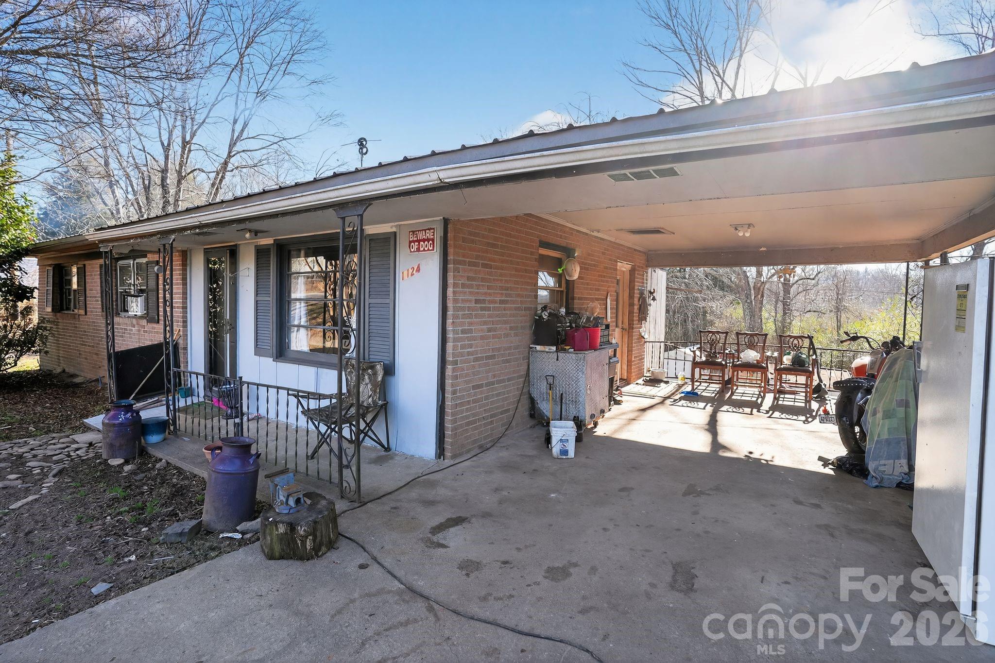 1124 Walshtown Road Boomer, NC 28606 - Photo 2 of 15 a view of a patio with dining table and chairs