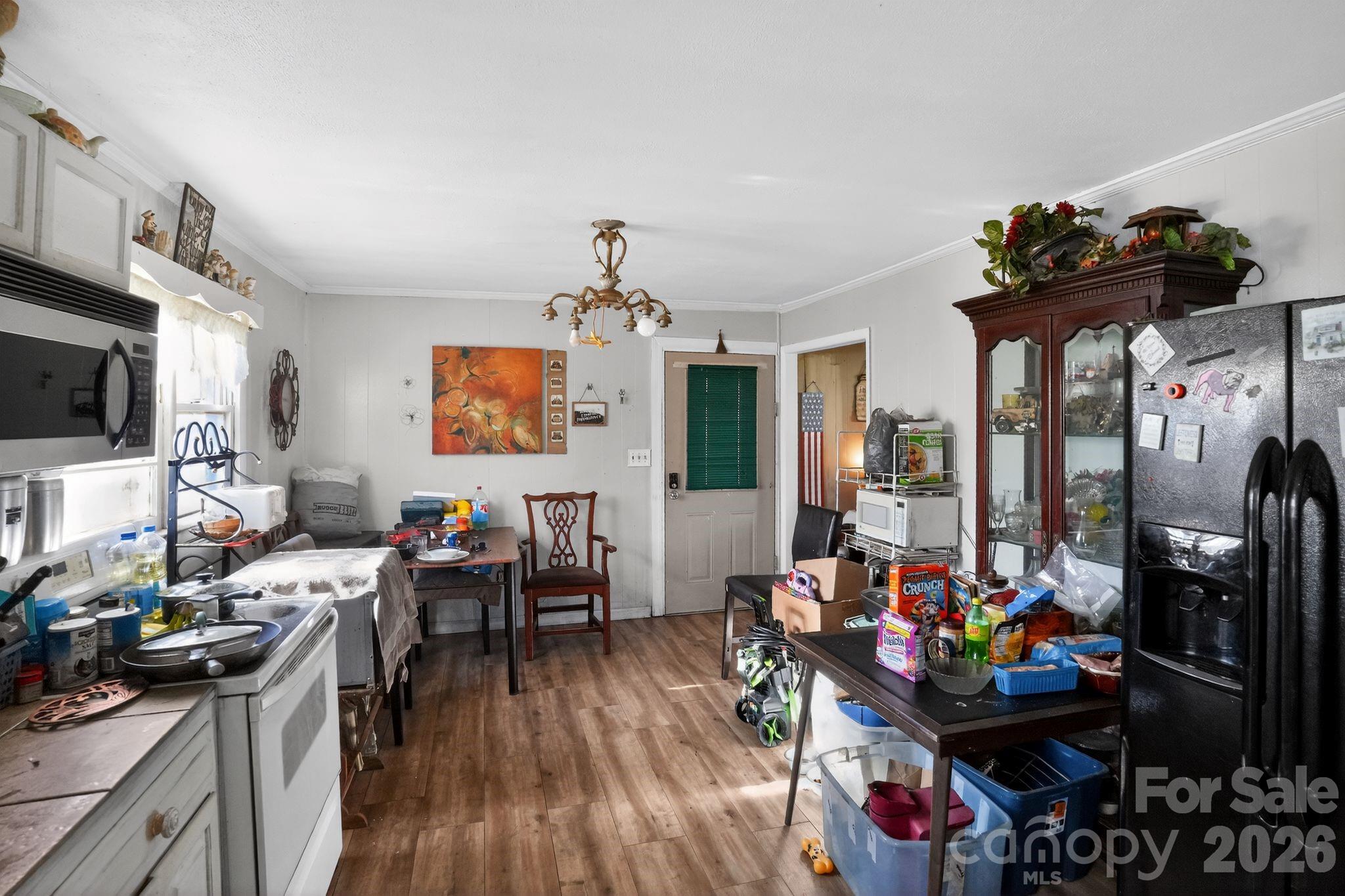 1124 Walshtown Road Boomer, NC 28606 - Photo 6 of 15 a living room filled with furniture and a flat screen tv