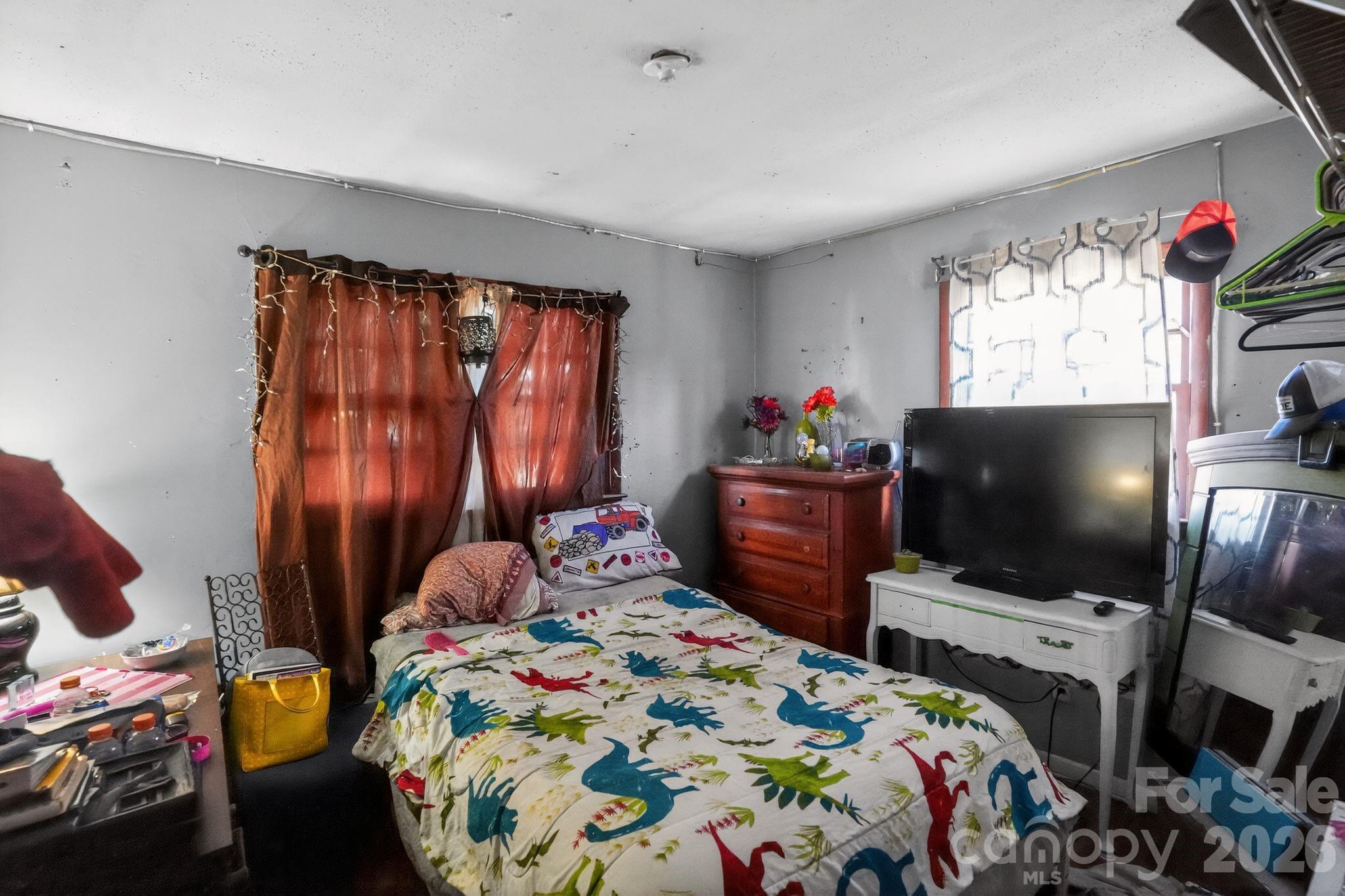 1124 Walshtown Road Boomer, NC 28606 - Photo 8 of 15 a bedroom with bed and a flat screen tv