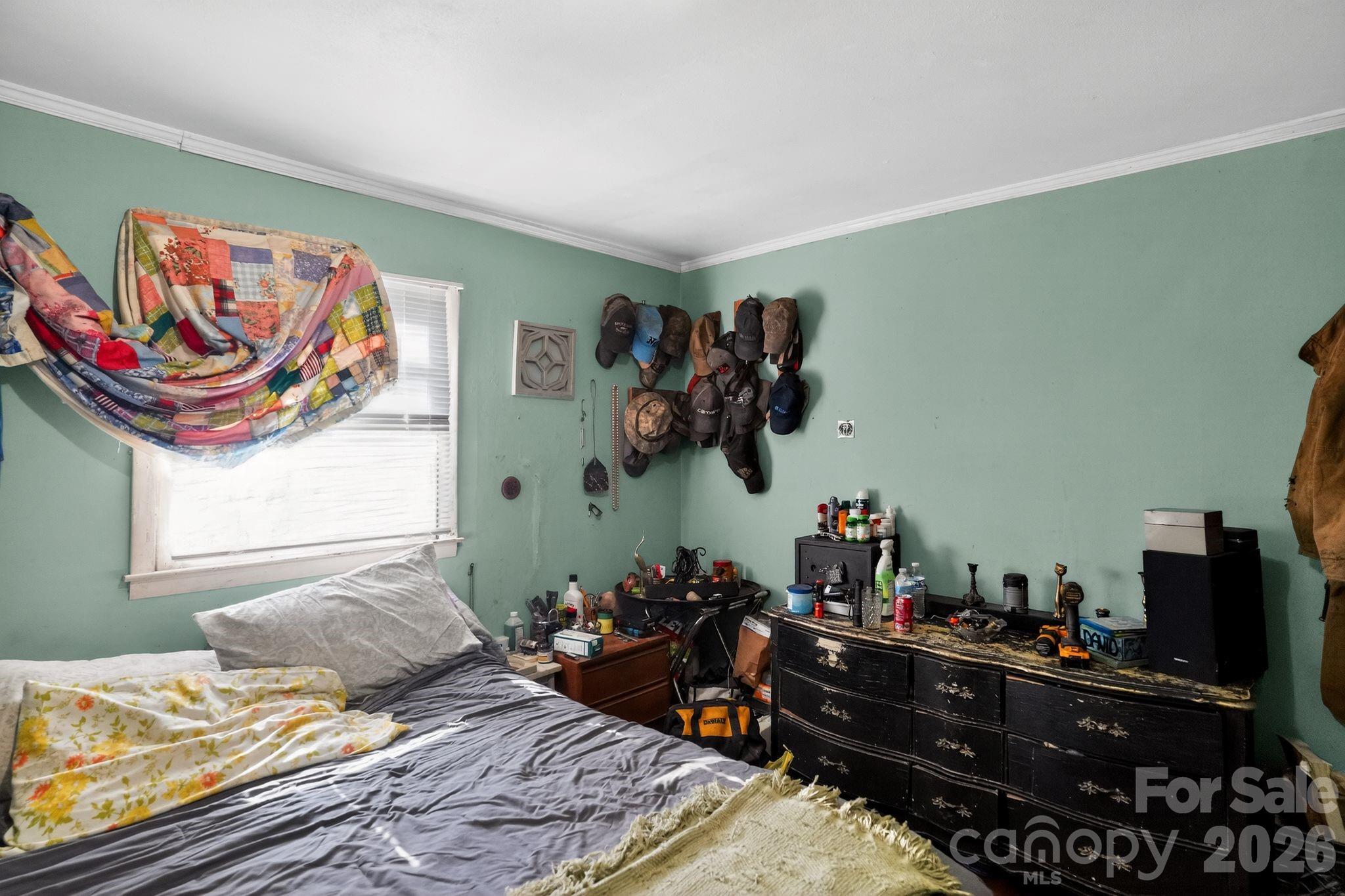 1124 Walshtown Road Boomer, NC 28606 - Photo 10 of 15 a bedroom with a bed and wooden floor