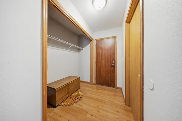 a area with wooden floor and closet
