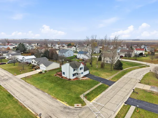 an aerial view of a houses with outdoor space