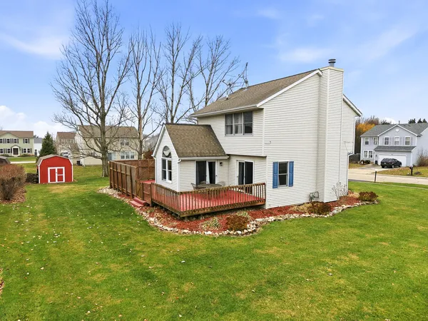 a picture of a bench in front of a building