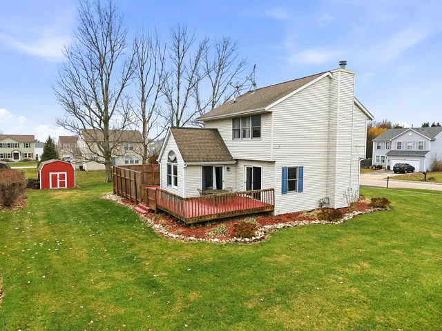 a picture of a bench in front of a building