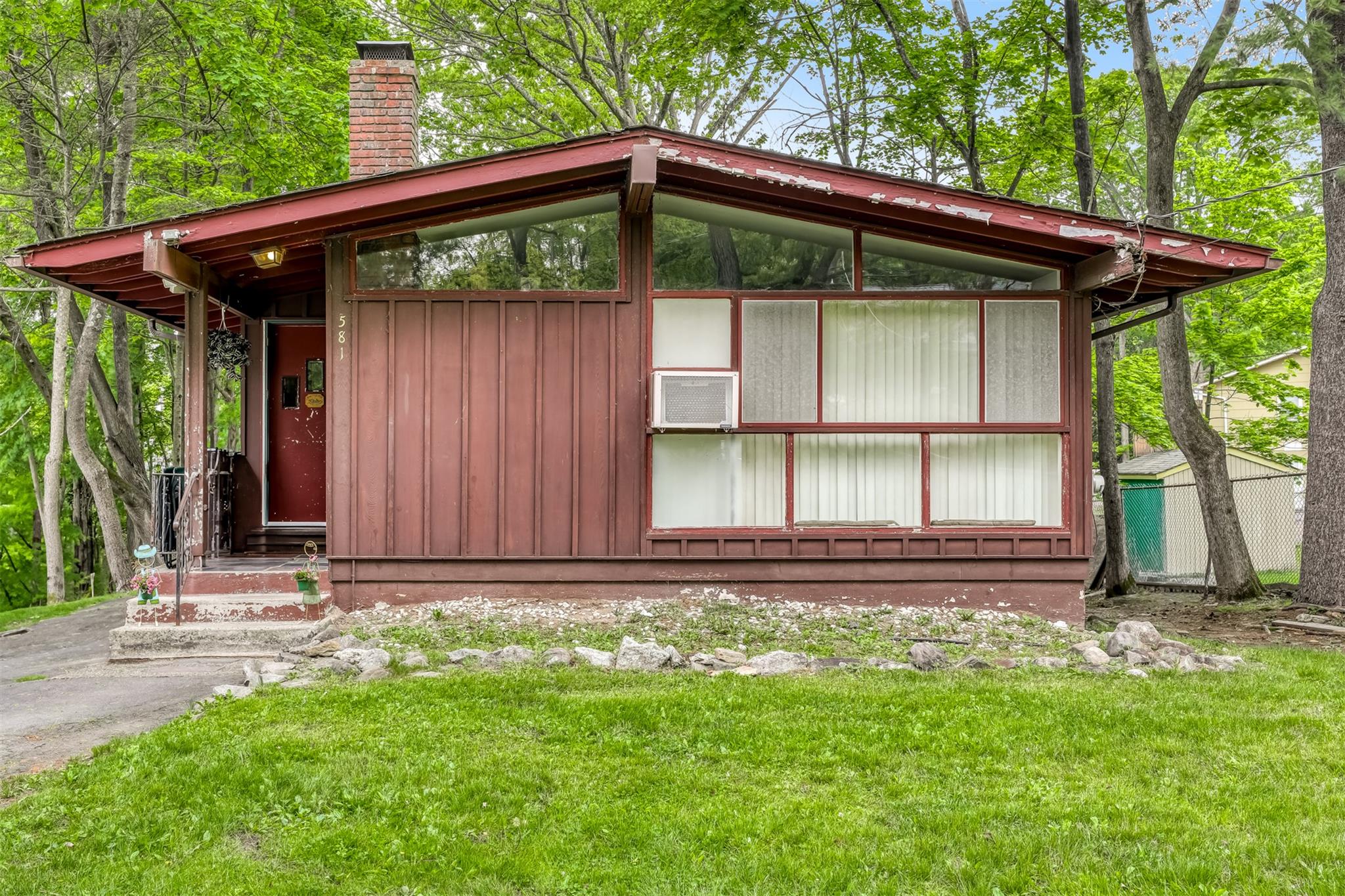 a front view of a house with garden
