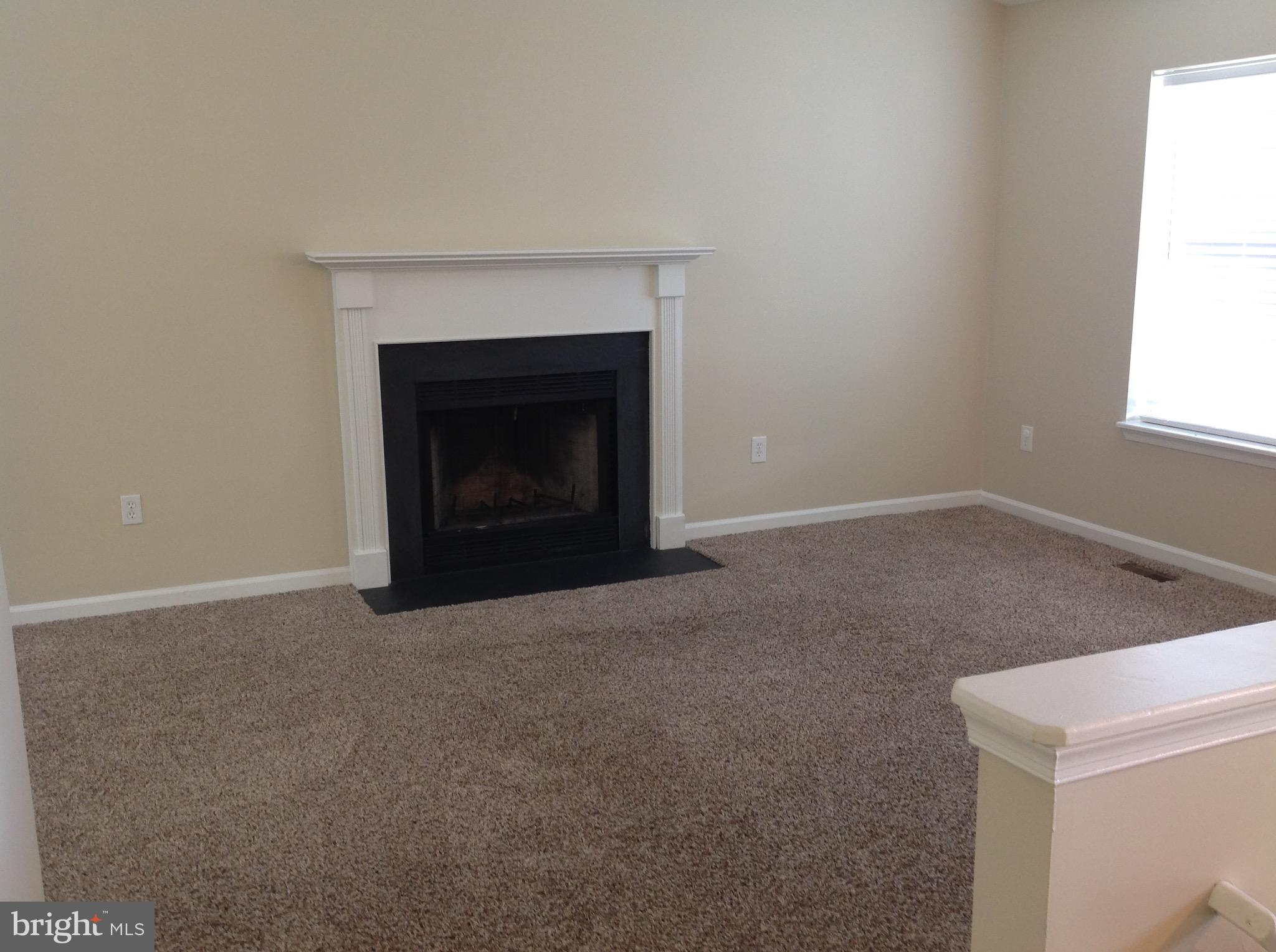 970 Point Pleasant Road Glen Burnie, MD 21060 - Photo 11 of 44 The living room has a fireplace