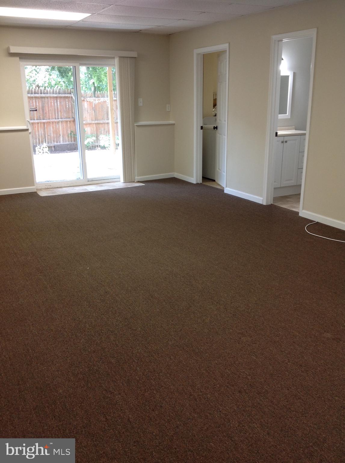 970 Point Pleasant Road Glen Burnie, MD 21060 - Photo 29 of 44 Lower level great room looking out to back patio