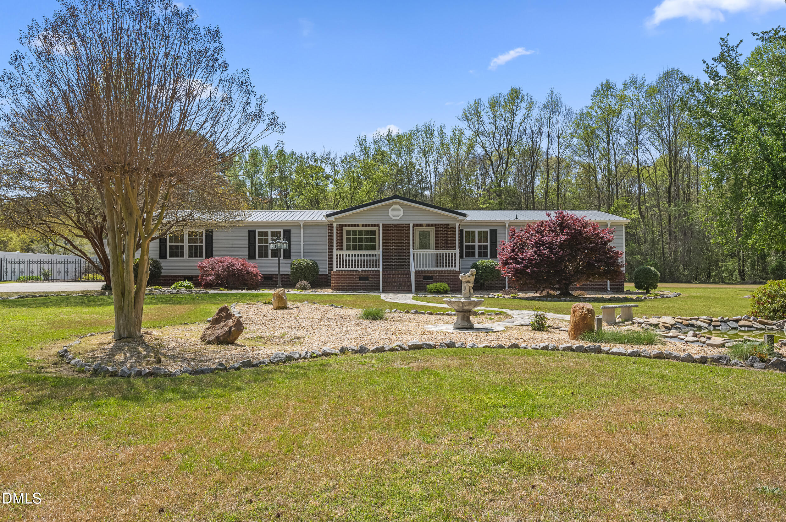 221 Pinkney Church Road Fremont, NC 27830 - Photo 2 of 36 a front view of a house with swimming pool and porch with furniture