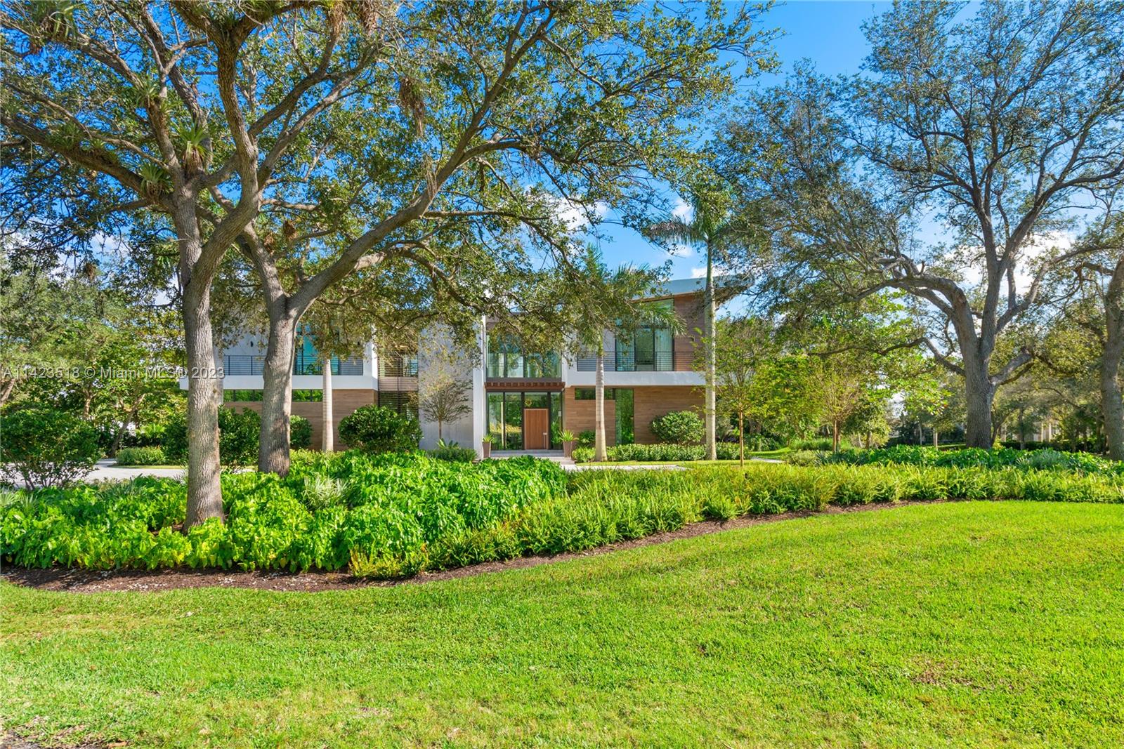 2690 Hackney Road Weston, FL 33331 - Photo 13 of 88 a front view of a house with a yard