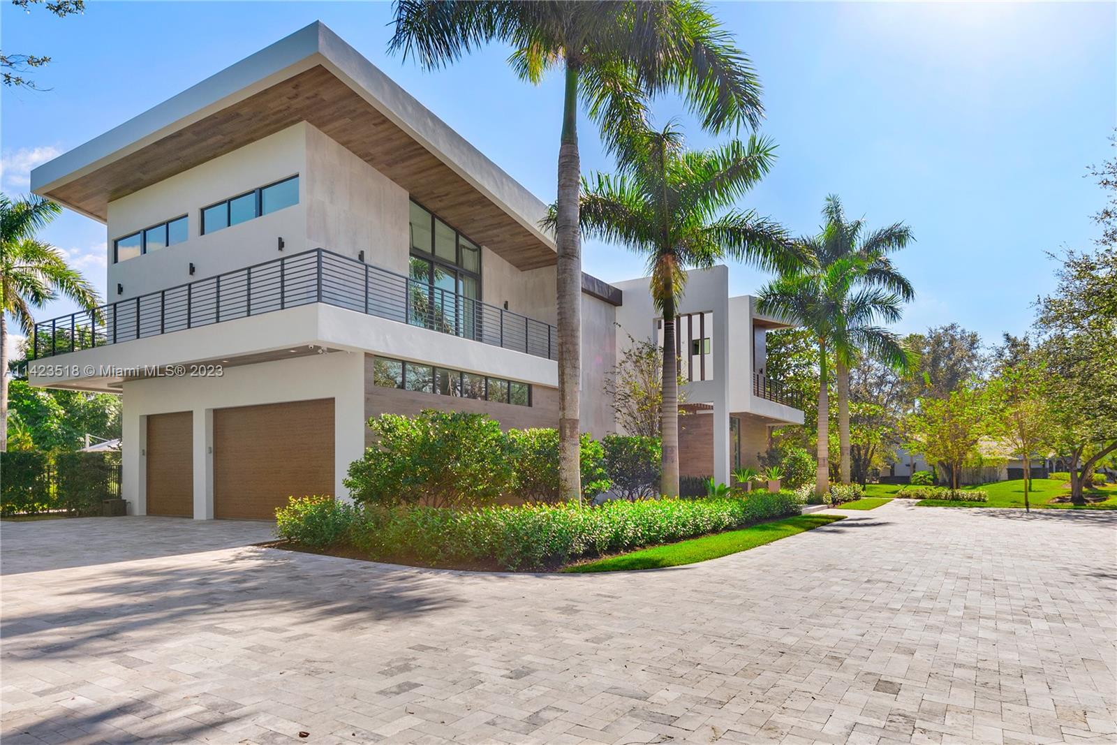 2690 Hackney Road Weston, FL 33331 - Photo 16 of 88 a front view of multiple houses with yard and green space