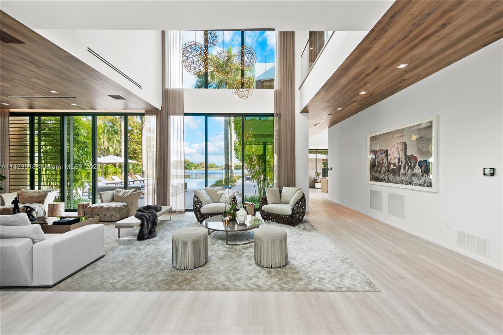 2690 Hackney Road Weston, FL 33331 - Photo 24 of 88 a living room with furniture and floor to ceiling windows