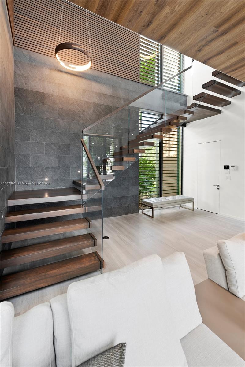 2690 Hackney Road Weston, FL 33331 - Photo 30 of 88 a view of entryway and hall with wooden floor