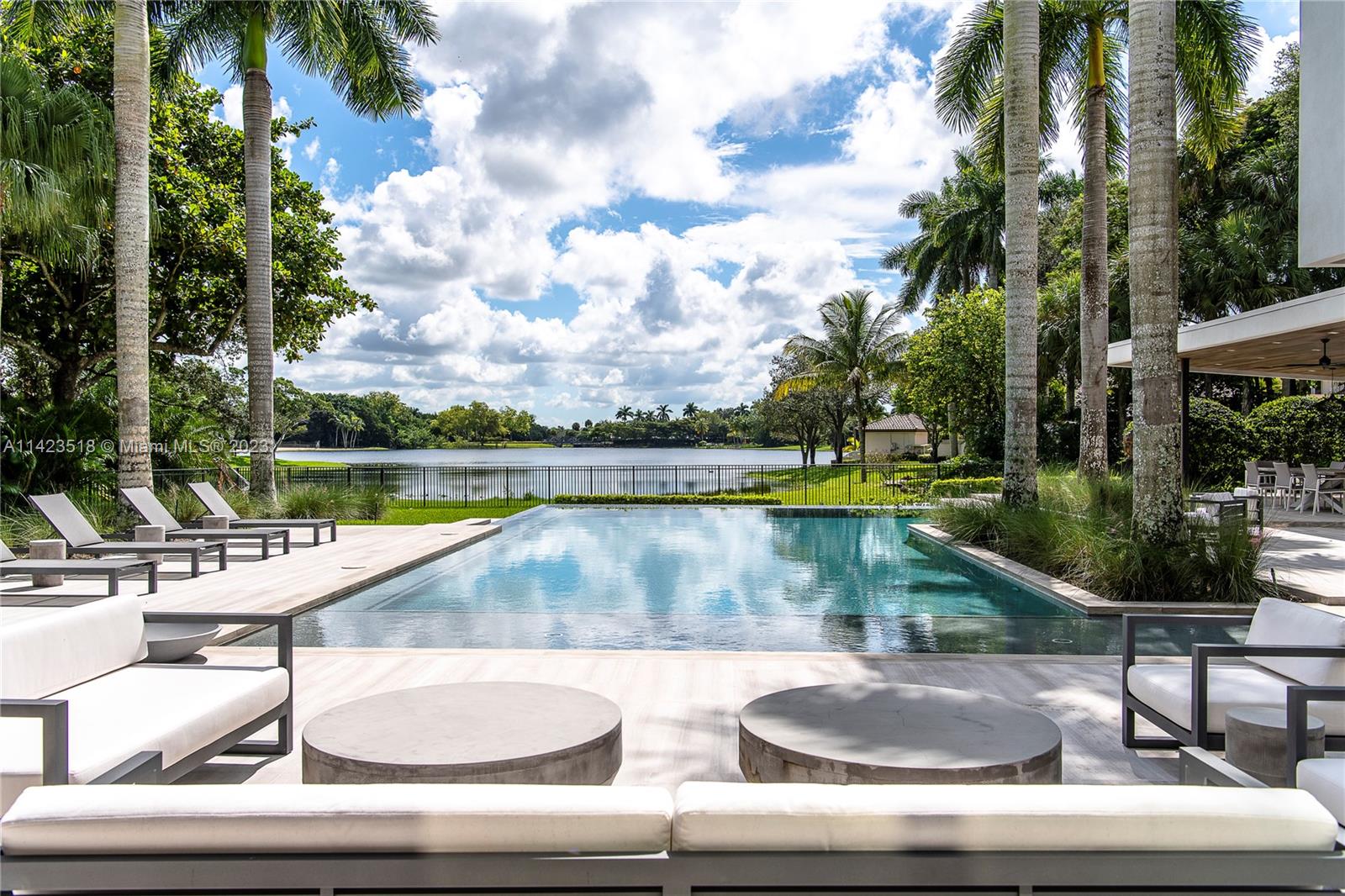 2690 Hackney Road Weston, FL 33331 - Photo 3 of 88 a view of swimming pool with seating area and trees in the background