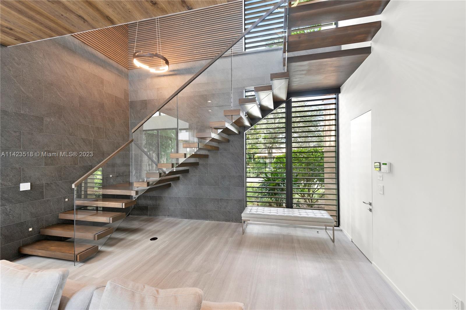 2690 Hackney Road Weston, FL 33331 - Photo 31 of 88 a view of entryway and hall with wooden floor