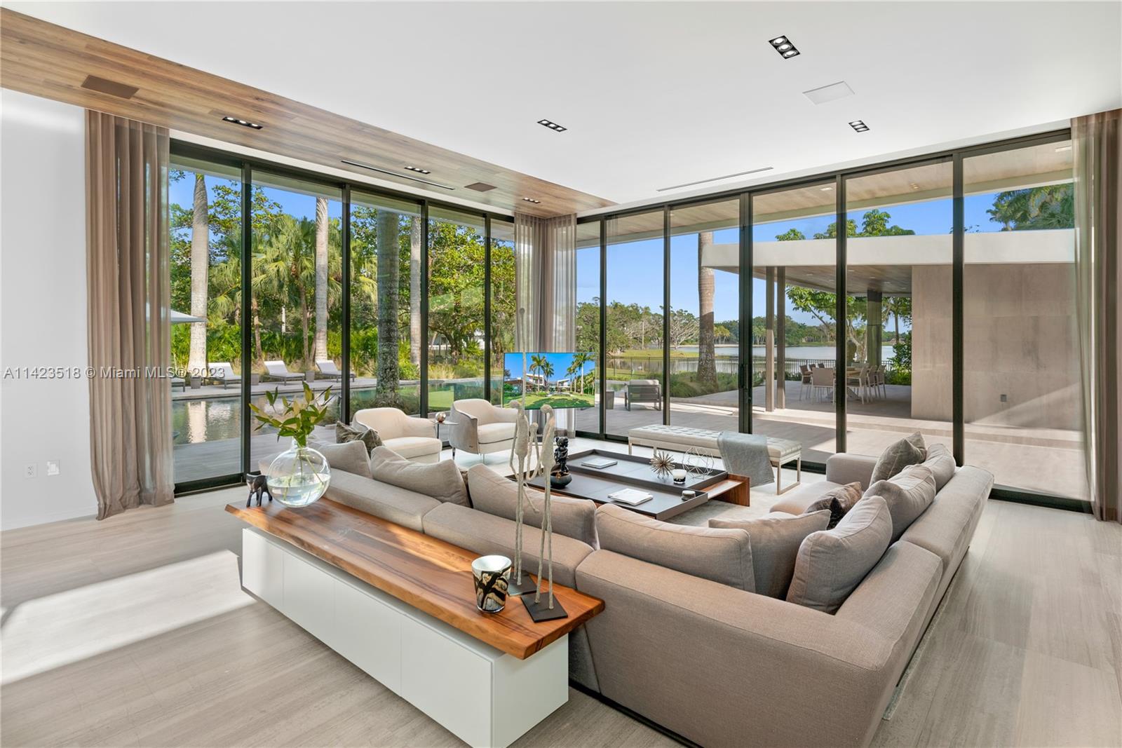 2690 Hackney Road Weston, FL 33331 - Photo 38 of 88 a living room with furniture and floor to ceiling windows