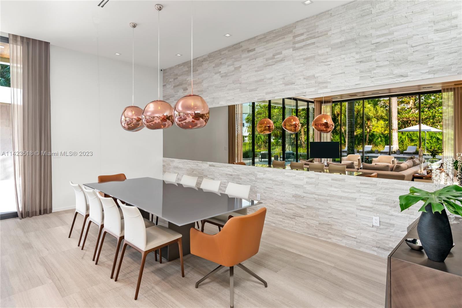 2690 Hackney Road Weston, FL 33331 - Photo 45 of 88 a view of a dining room with furniture large windows and wooden floor