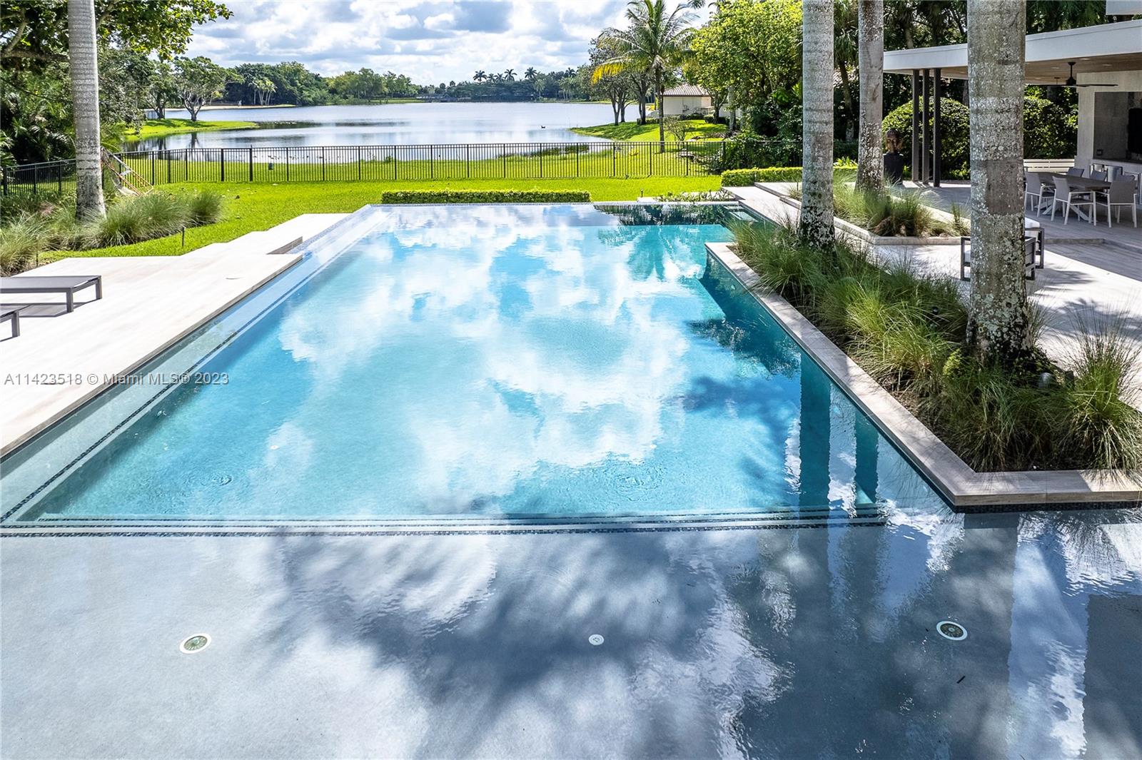 2690 Hackney Road Weston, FL 33331 - Photo 5 of 88 a view of a swimming pool with a yard