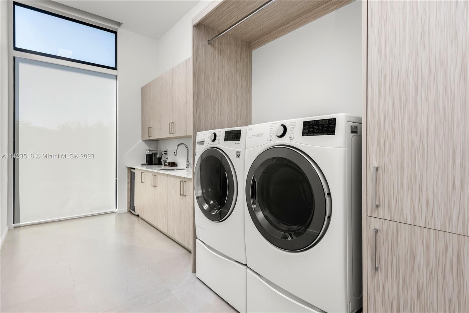 2690 Hackney Road Weston, FL 33331 - Photo 54 of 88 a utility room with dryer and washer