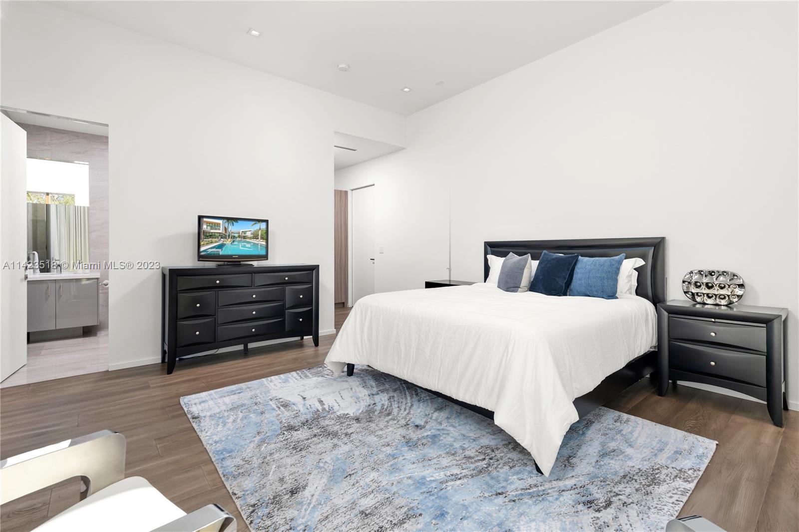 2690 Hackney Road Weston, FL 33331 - Photo 56 of 88 a bedroom with a bed and a dresser