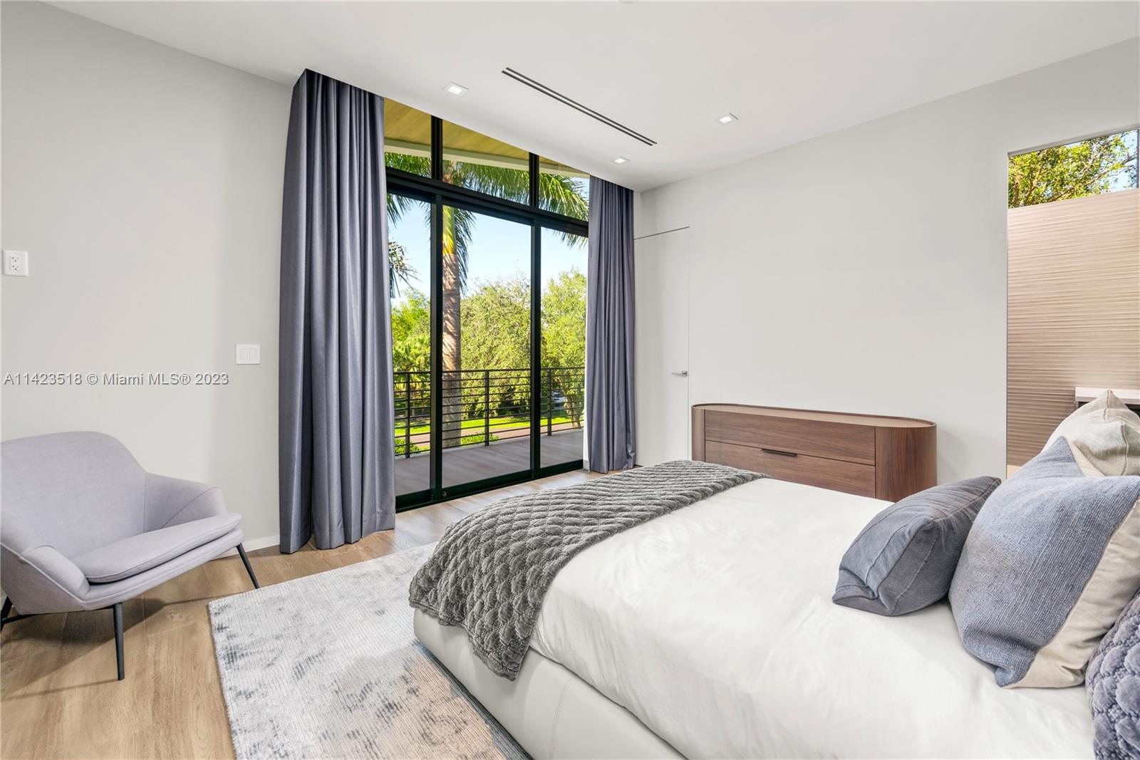 2690 Hackney Road Weston, FL 33331 - Photo 59 of 88 a bedroom with a bed and a large window