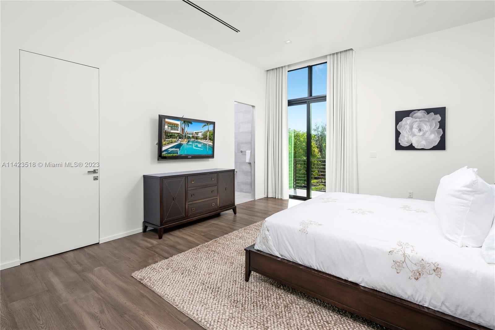 2690 Hackney Road Weston, FL 33331 - Photo 62 of 88 a bedroom with a bed and a window