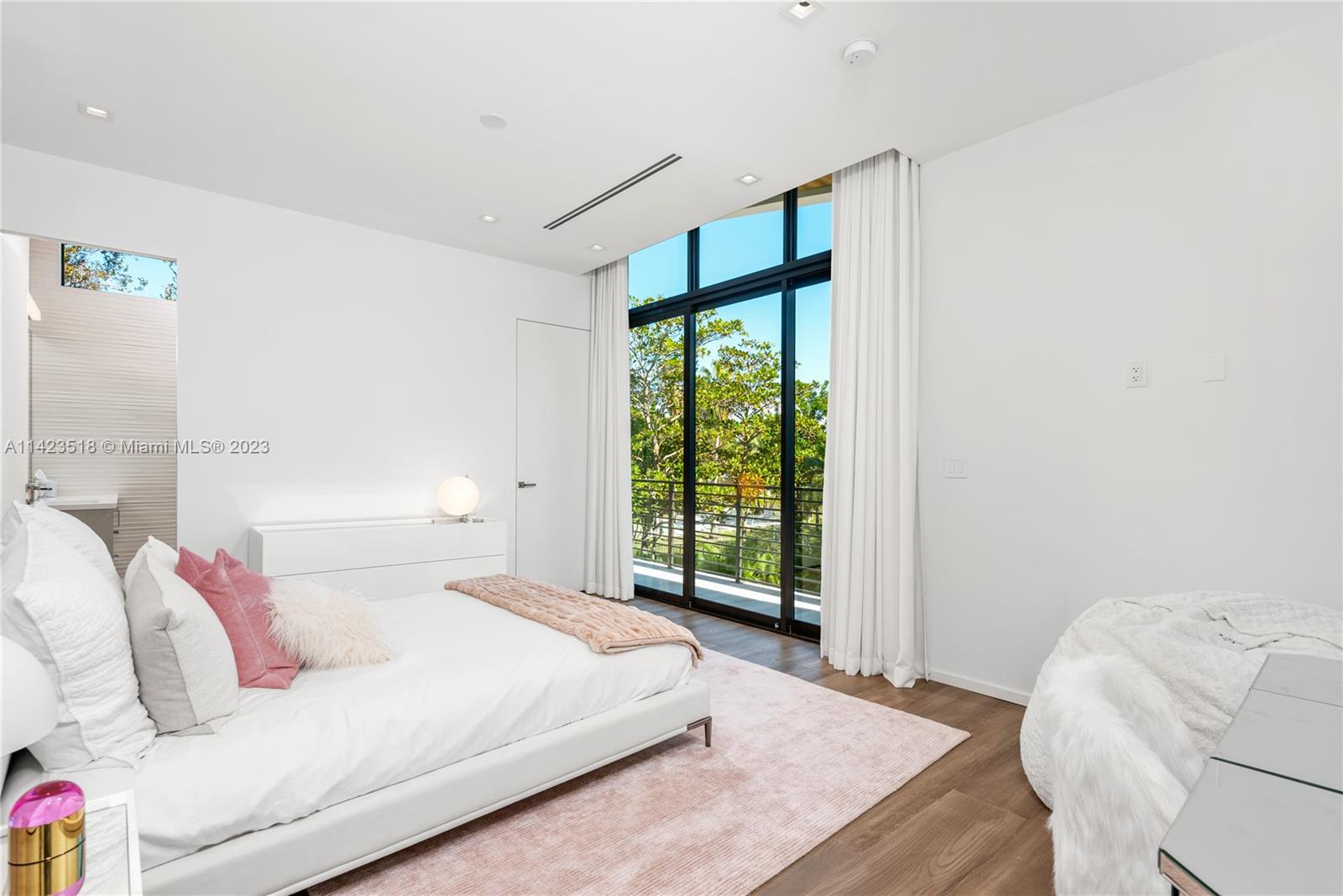 2690 Hackney Road Weston, FL 33331 - Photo 64 of 88 a bedroom with a bed and a large window