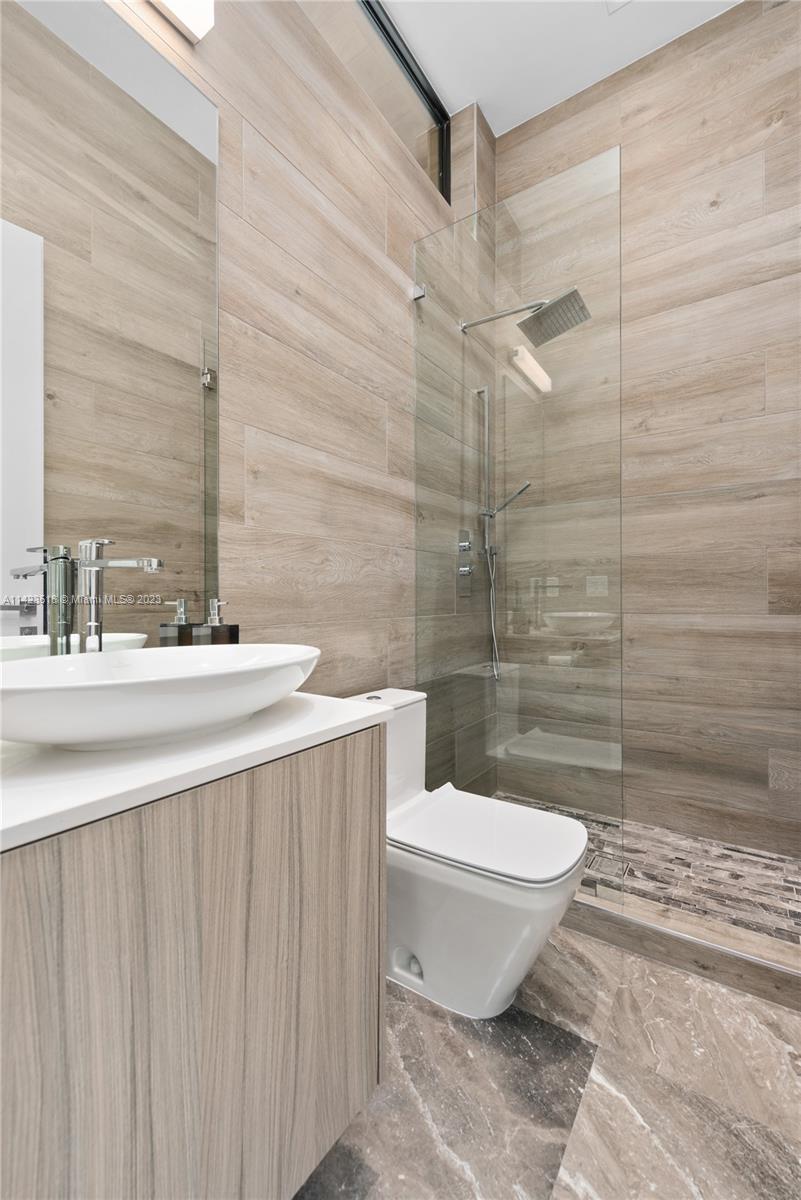 2690 Hackney Road Weston, FL 33331 - Photo 68 of 88 a bathroom with a sink a toilet and shower