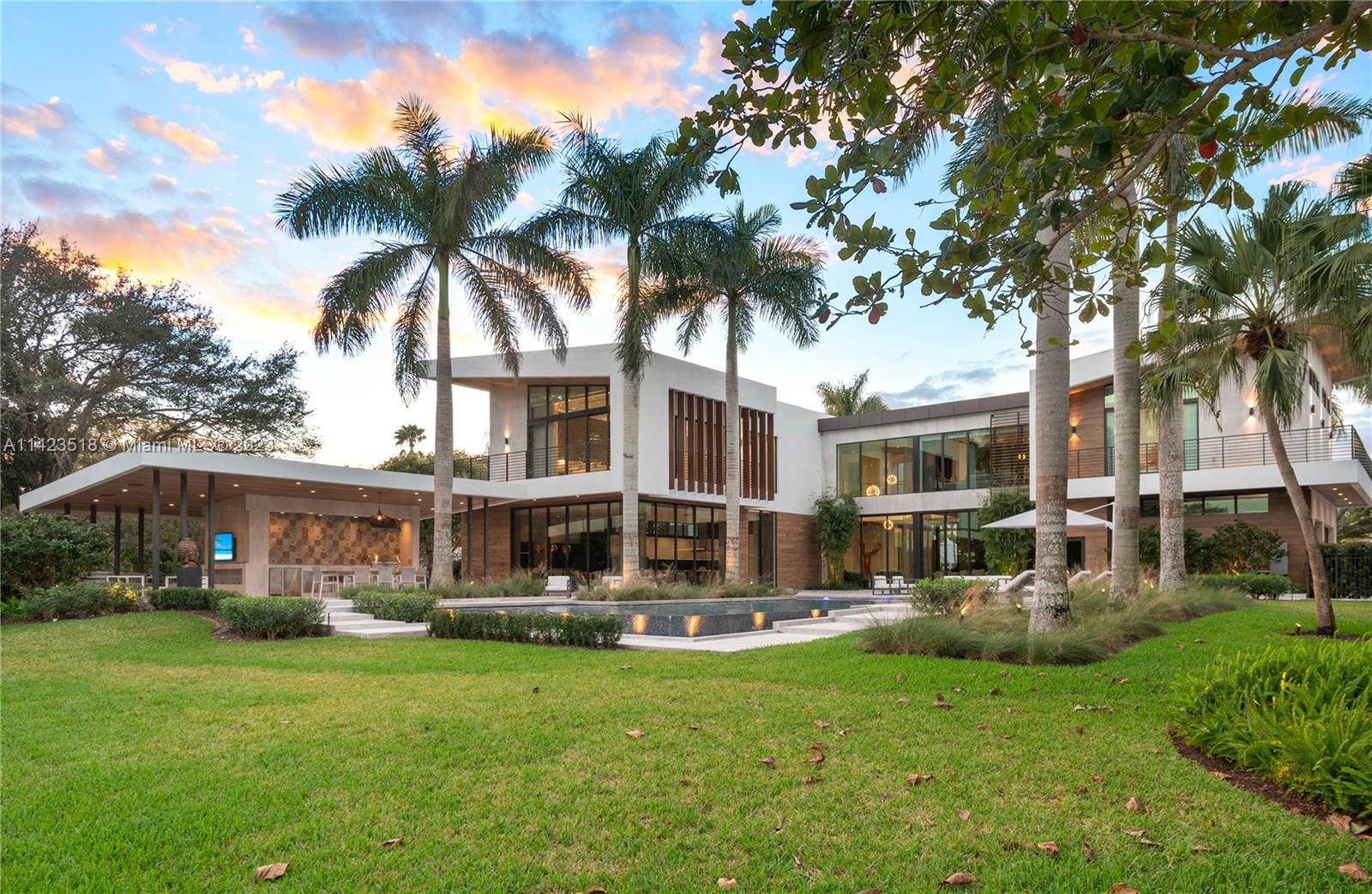 2690 Hackney Road Weston, FL 33331 - Photo 70 of 88 a front view of a house with a garden and trees