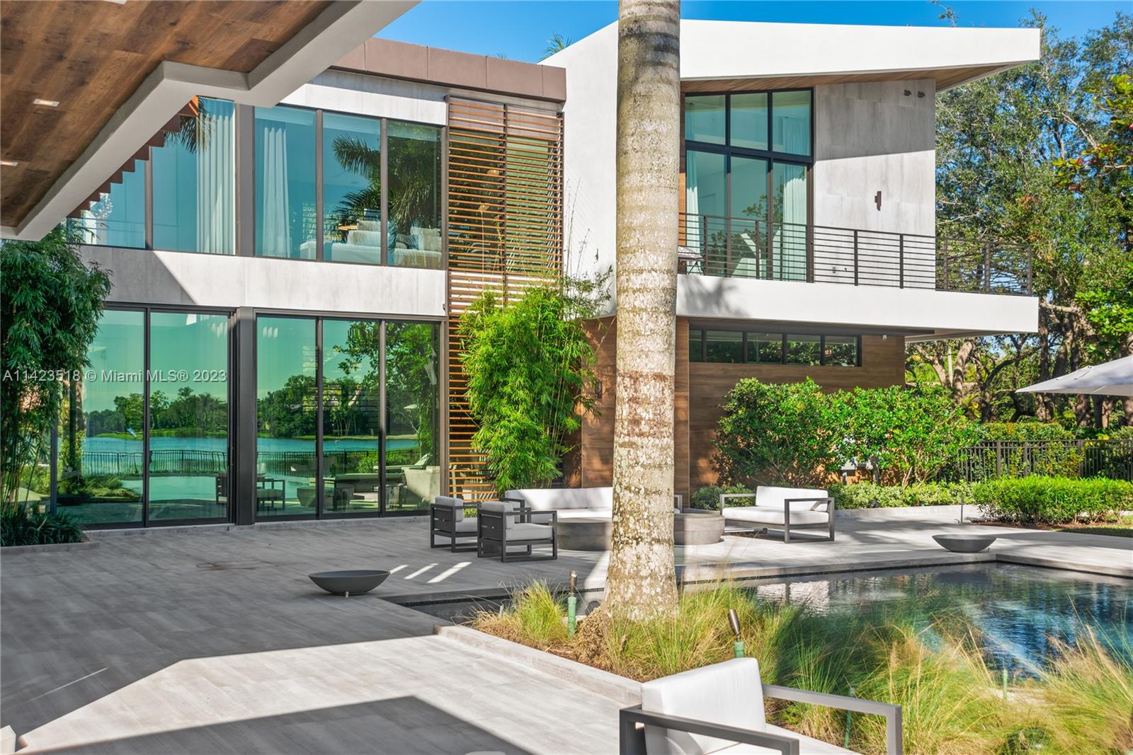 2690 Hackney Road Weston, FL 33331 - Photo 86 of 88 a view of a house with a yard patio and swimming pool