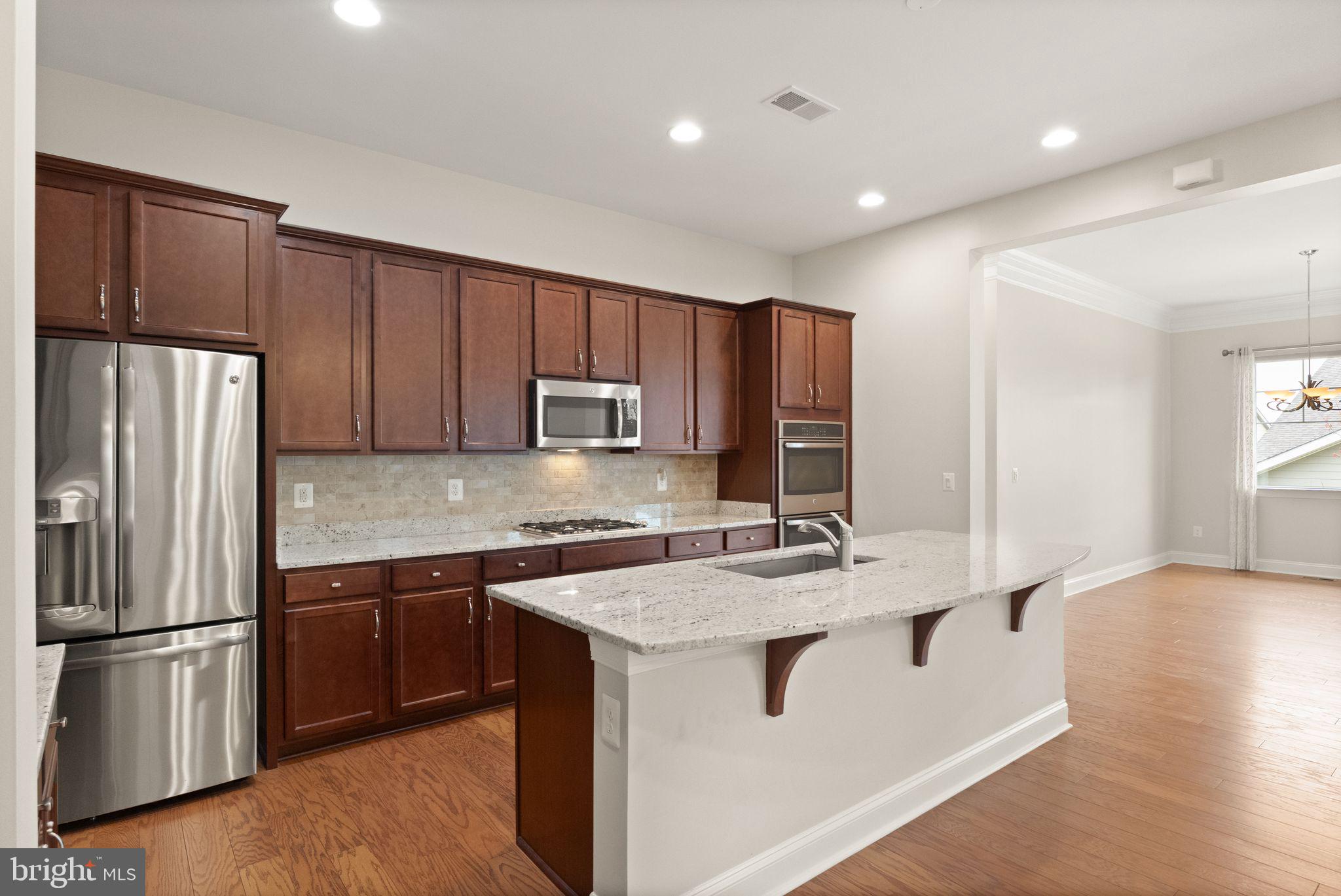 103 Cloak Lane White Post, VA 22663 - Photo 25 of 98 a kitchen with stainless steel appliances granite countertop a refrigerator a sink a stove a microwave and island