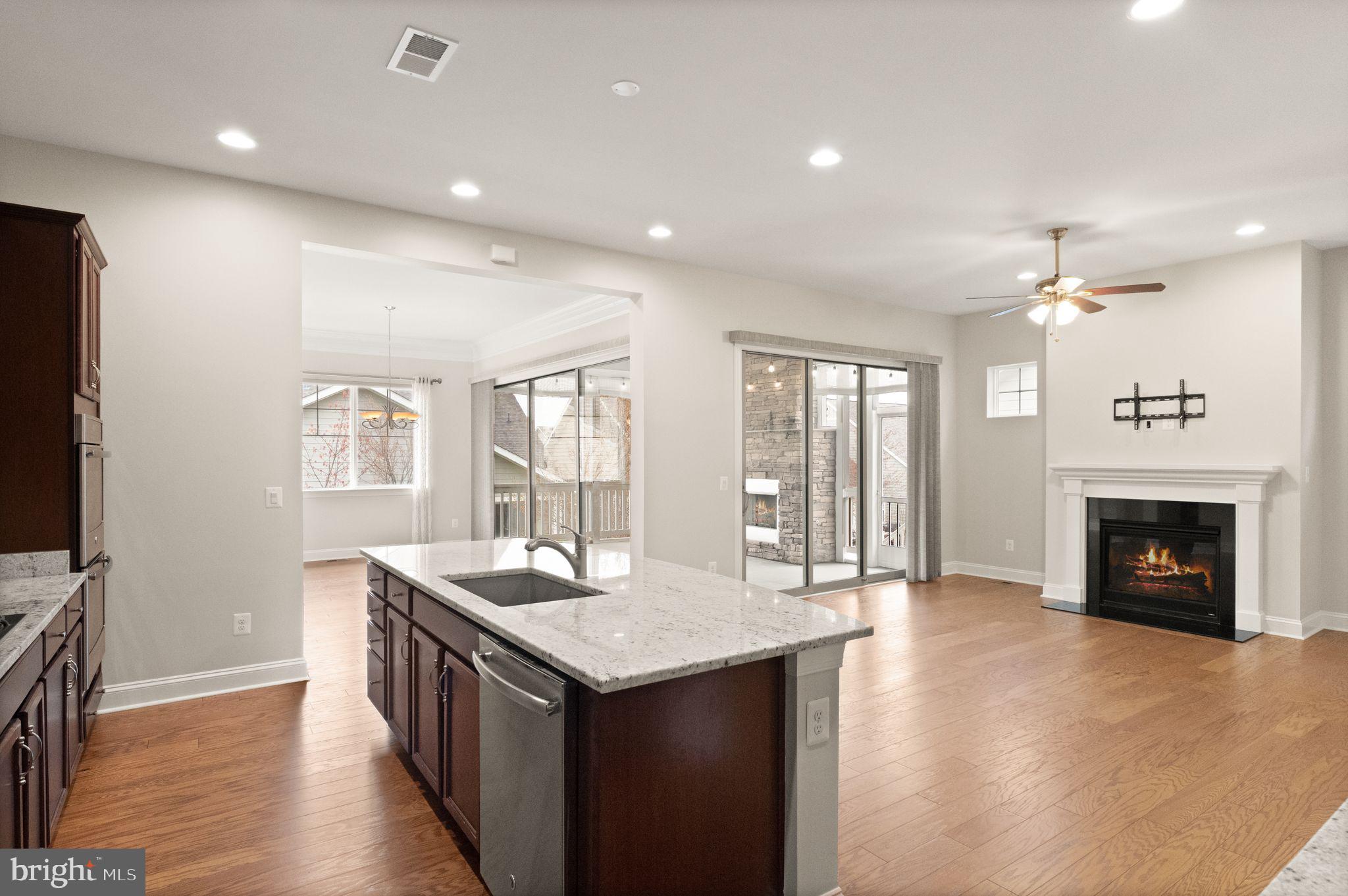 103 Cloak Lane White Post, VA 22663 - Photo 26 of 98 a dining hall with stainless steel appliances granite countertop a refrigerator a fireplace and a stove with wooden floor