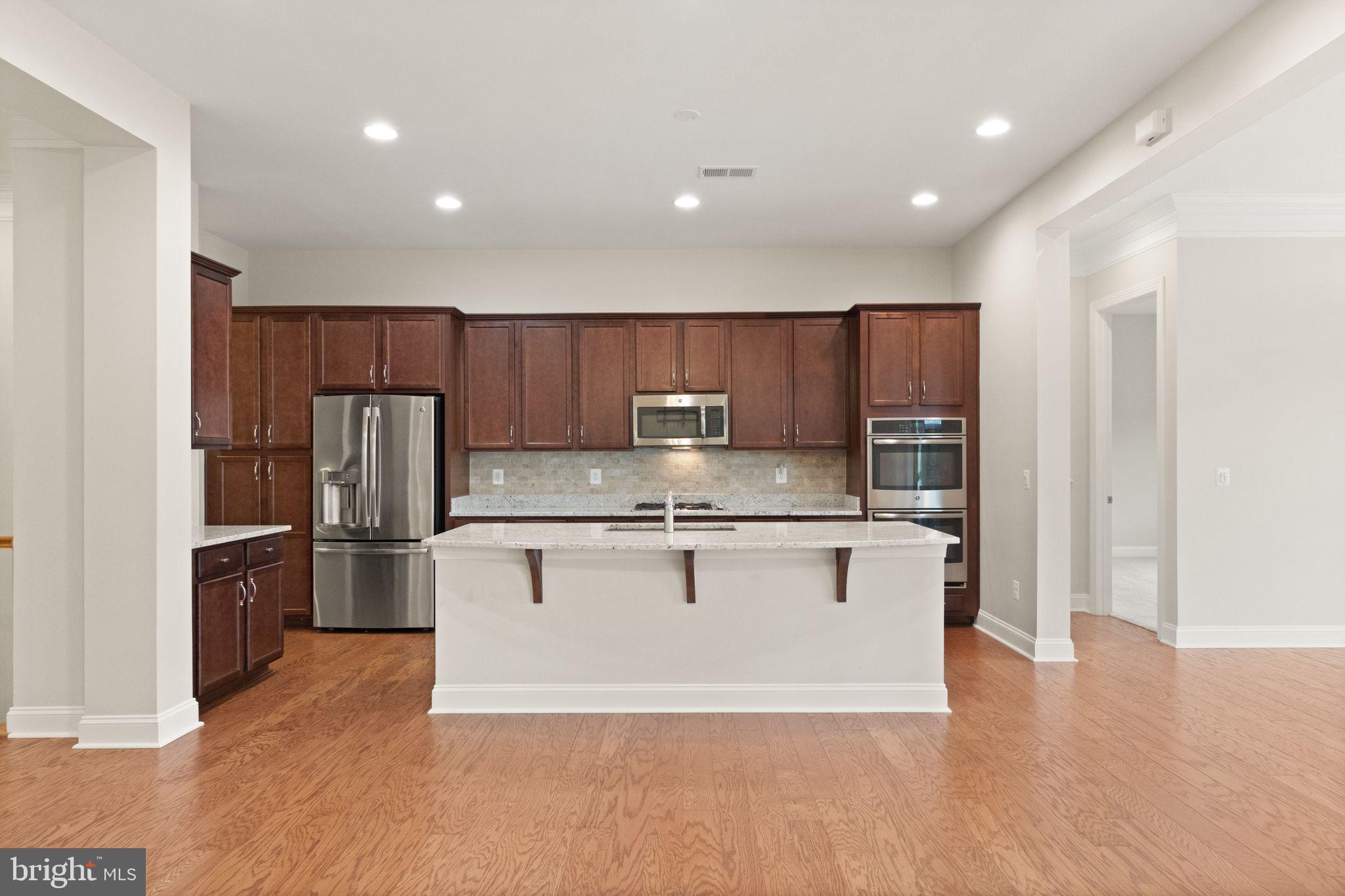 103 Cloak Lane White Post, VA 22663 - Photo 28 of 98 a kitchen with stainless steel appliances granite countertop a refrigerator and a stove top oven