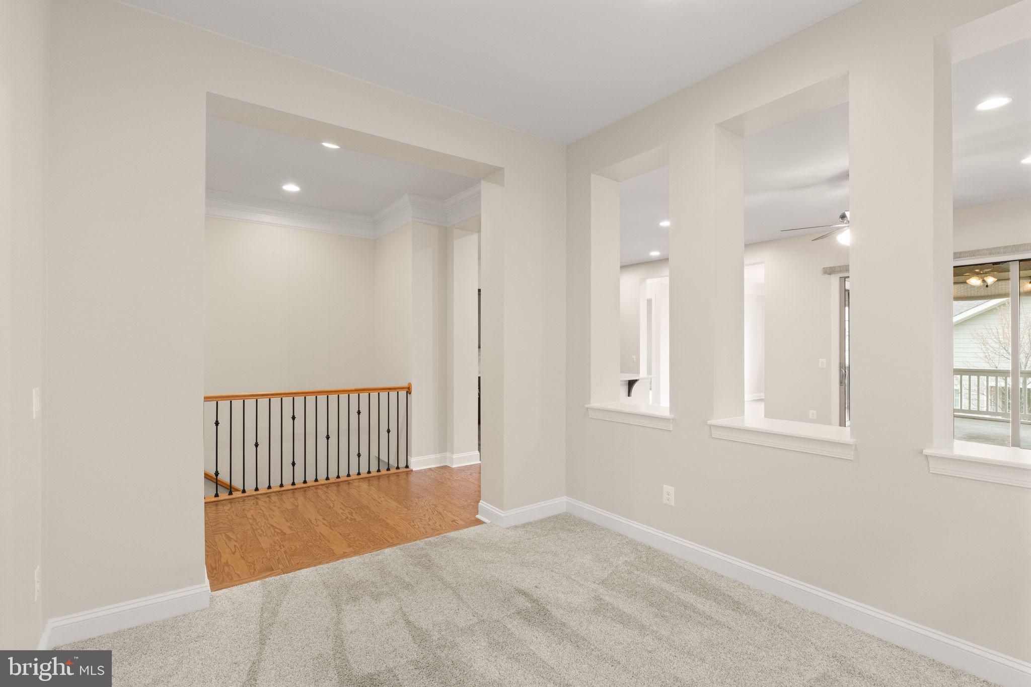 103 Cloak Lane White Post, VA 22663 - Photo 41 of 98 an empty room with wooden floor and windows