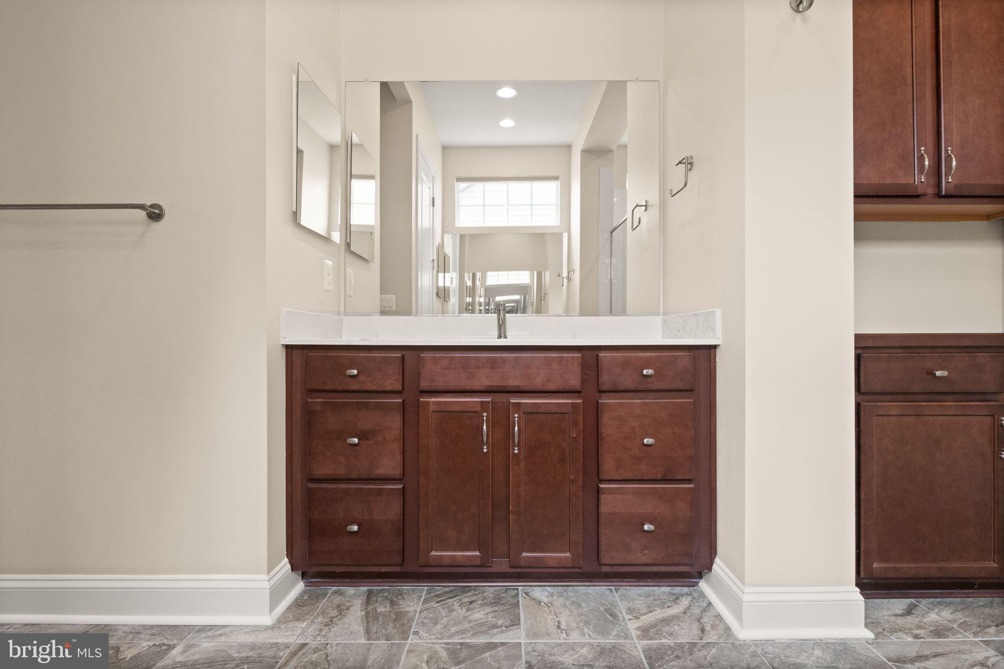 103 Cloak Lane White Post, VA 22663 - Photo 49 of 98 a bathroom with a granite countertop sink and a mirror
