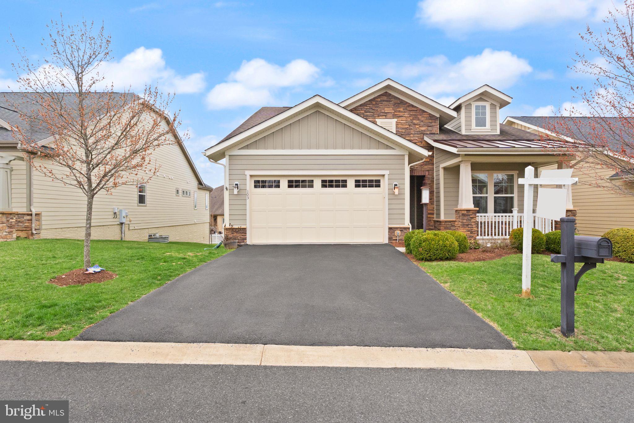 103 Cloak Lane White Post, VA 22663 - Photo 6 of 98 a front view of a house with a yard and garage