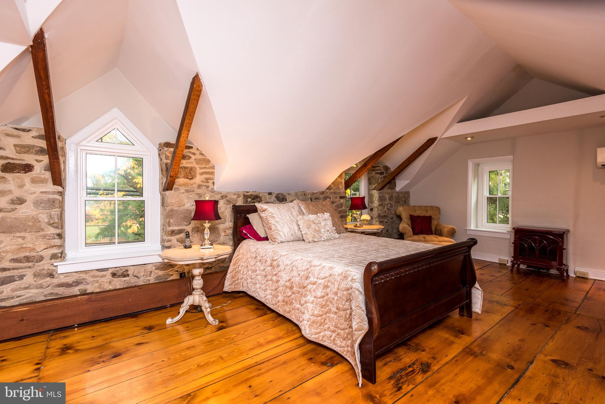 3264 Durham Road Doylestown, PA 18902 - Photo 25 of 37 Owners suite with stone walls and vaulted ceilings