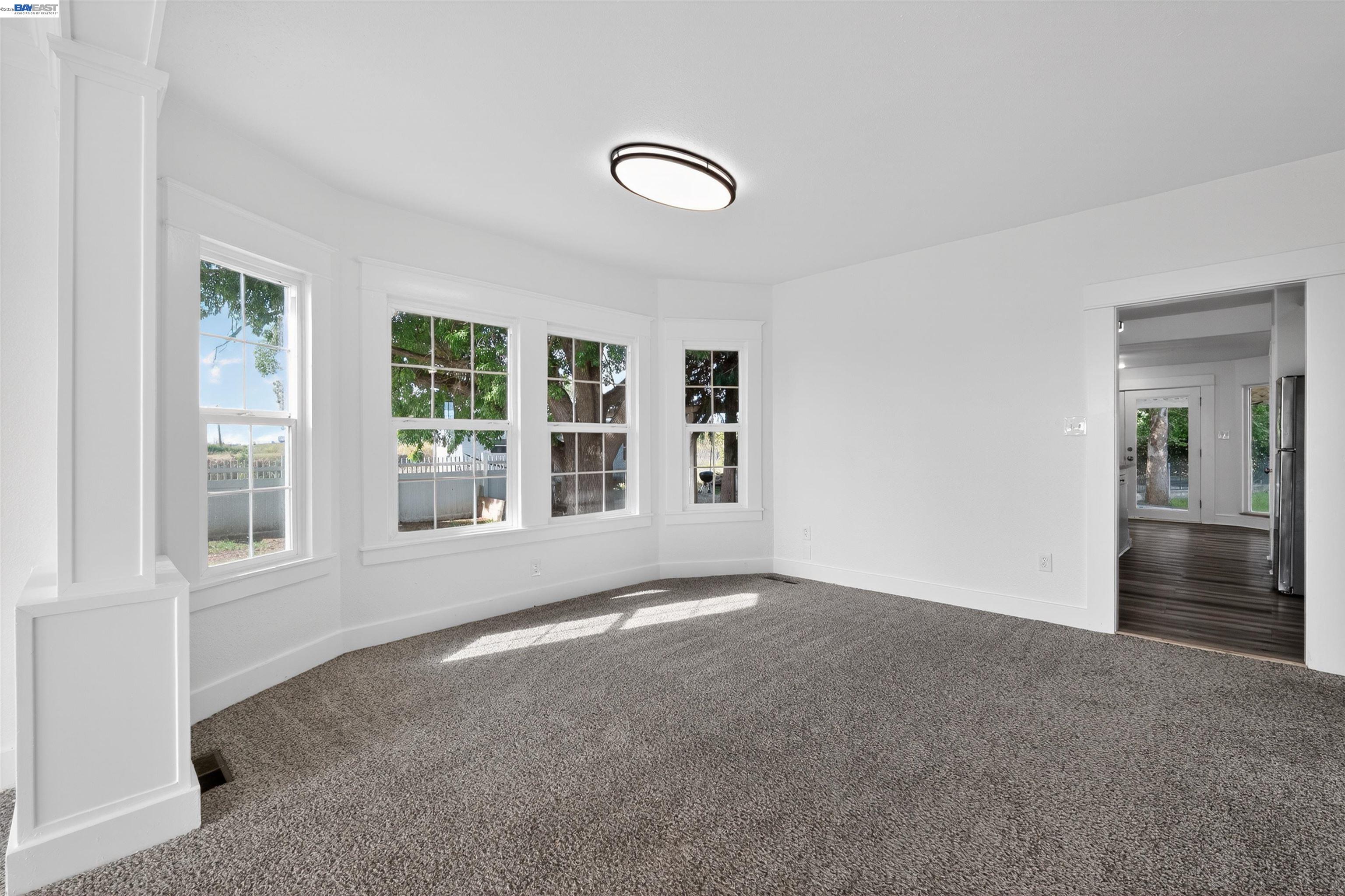 3015 Point Pleasant Road Elk Grove, CA 95757 - Photo 7 of 32 an empty room with windows