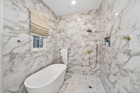 a white toilet sitting next to a bathroom sink