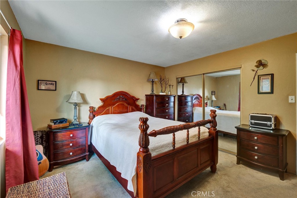 2435 Burkett Road El Monte, CA 91732 - Photo 12 of 52 a bedroom with a bed and a lamp