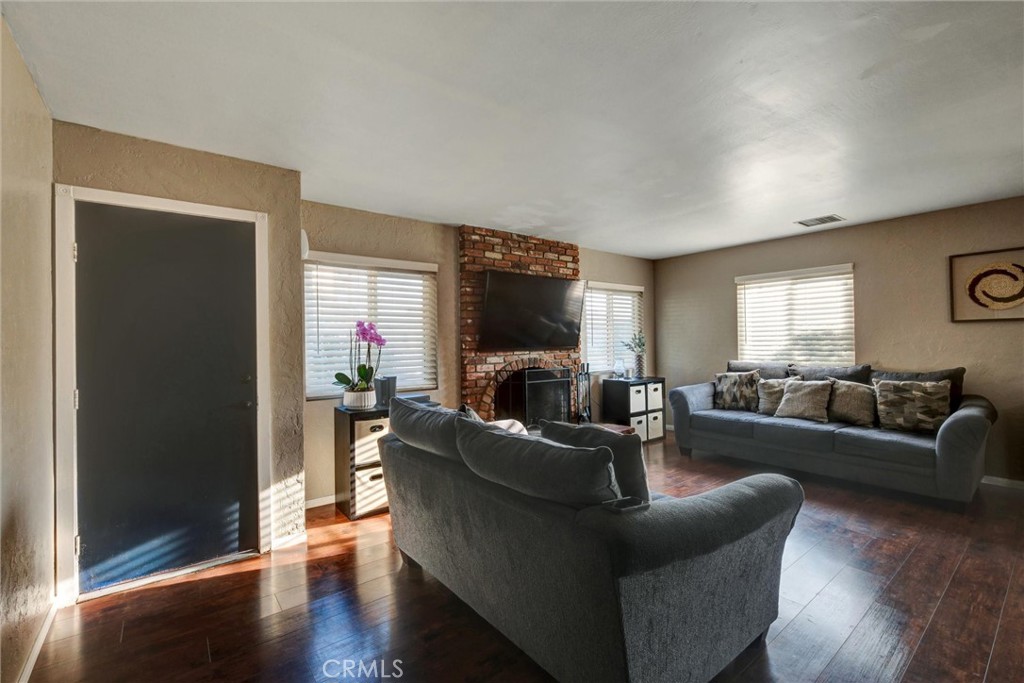 2435 Burkett Road El Monte, CA 91732 - Photo 18 of 52 a living room with furniture and a flat screen tv