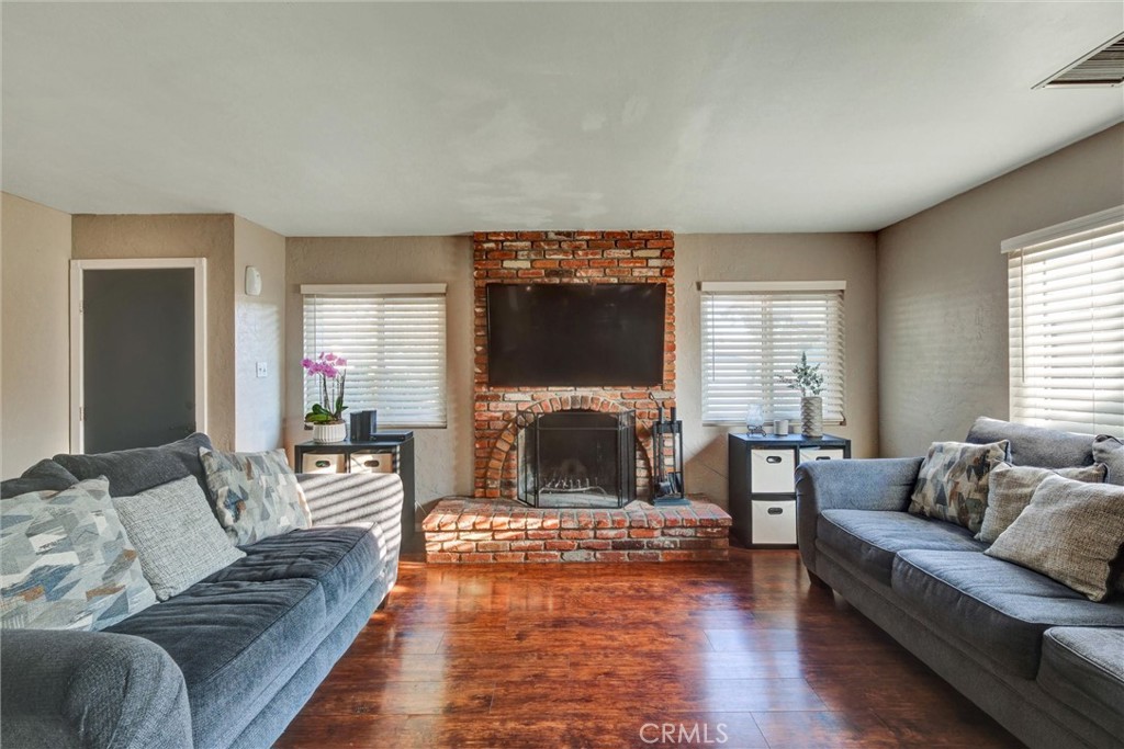 2435 Burkett Road El Monte, CA 91732 - Photo 20 of 52 a living room with furniture and a flat screen tv