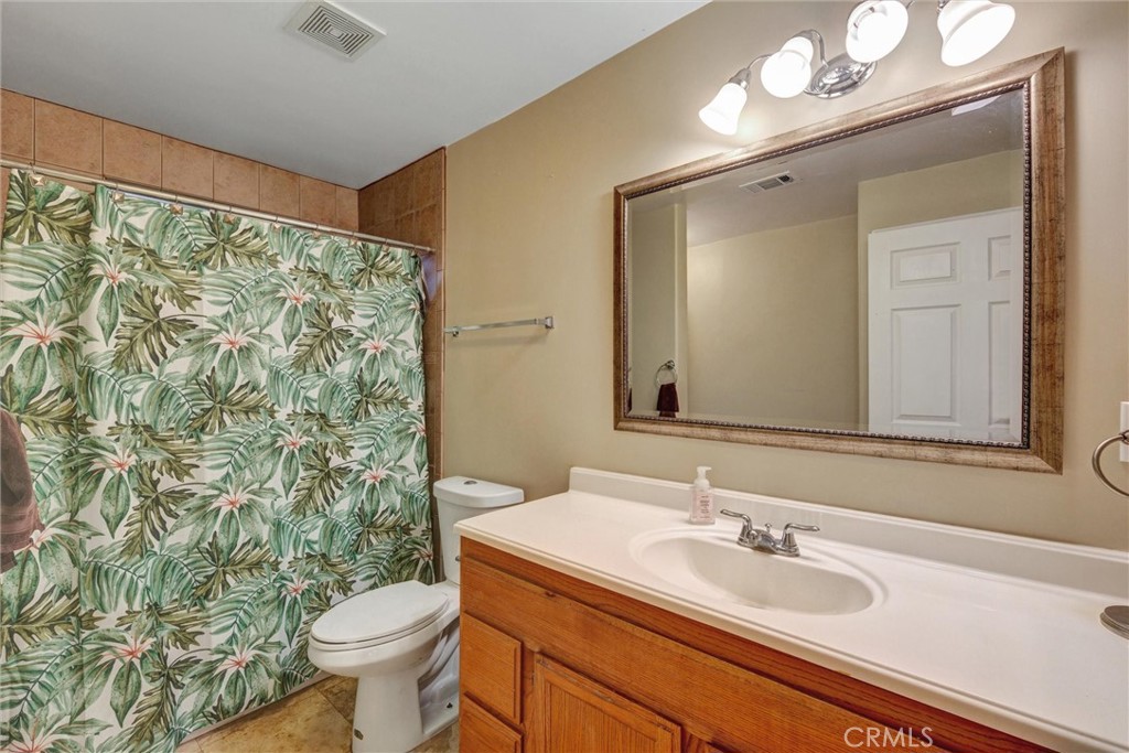 2435 Burkett Road El Monte, CA 91732 - Photo 35 of 52 a bathroom with a sink toilet and mirror
