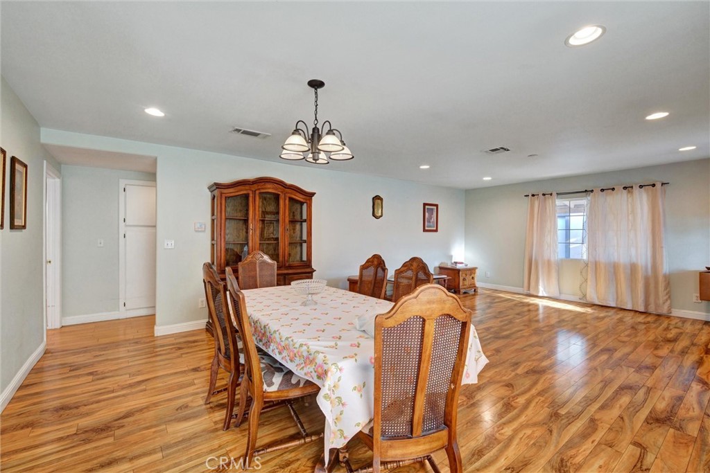 2435 Burkett Road El Monte, CA 91732 - Photo 40 of 52 a view of a dining room with furniture window and wooden floor