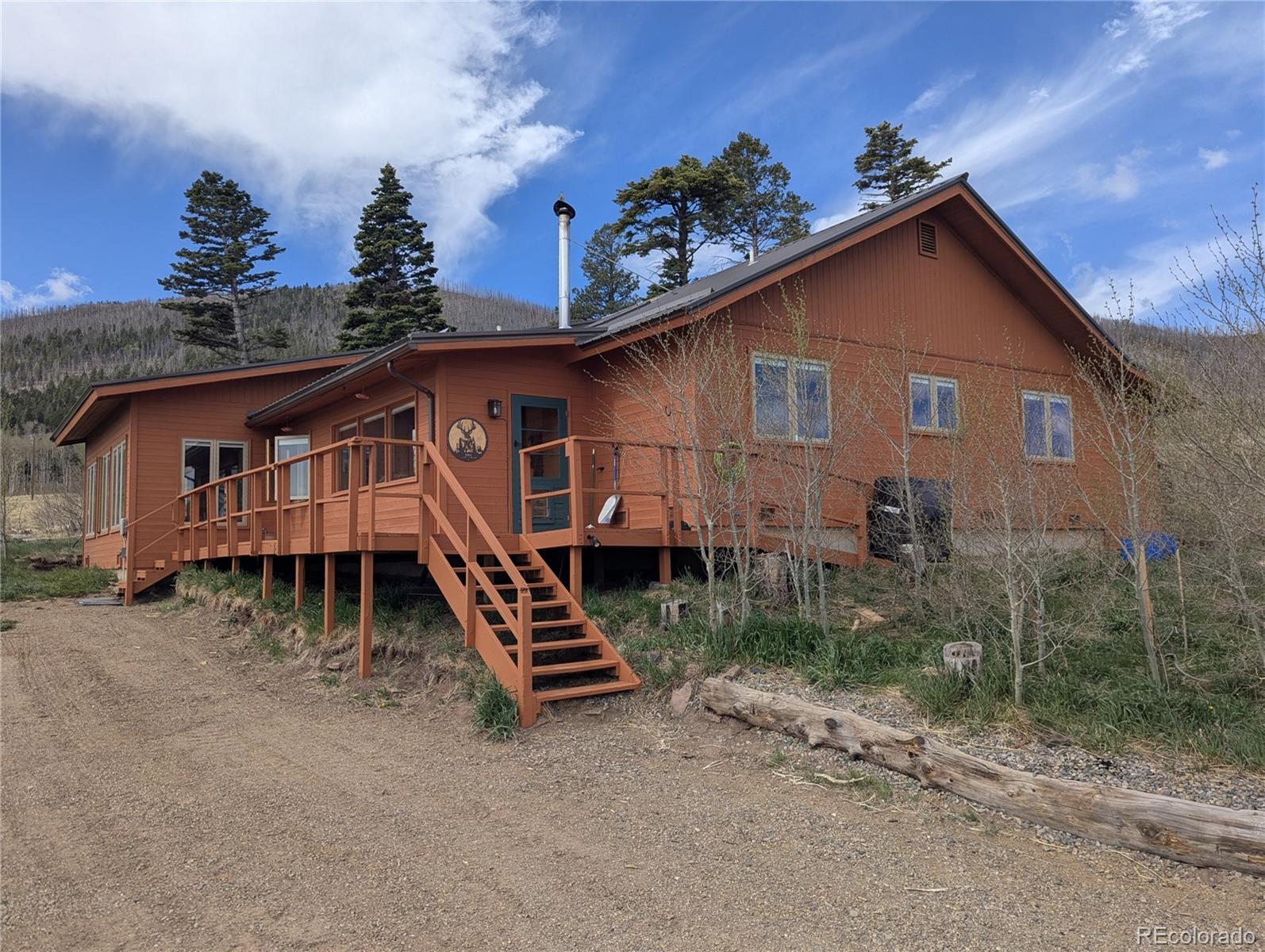 2084 Forbes Park Road Fort Garland, CO 81133 - Photo 3 of 39 a house with trees in the background
