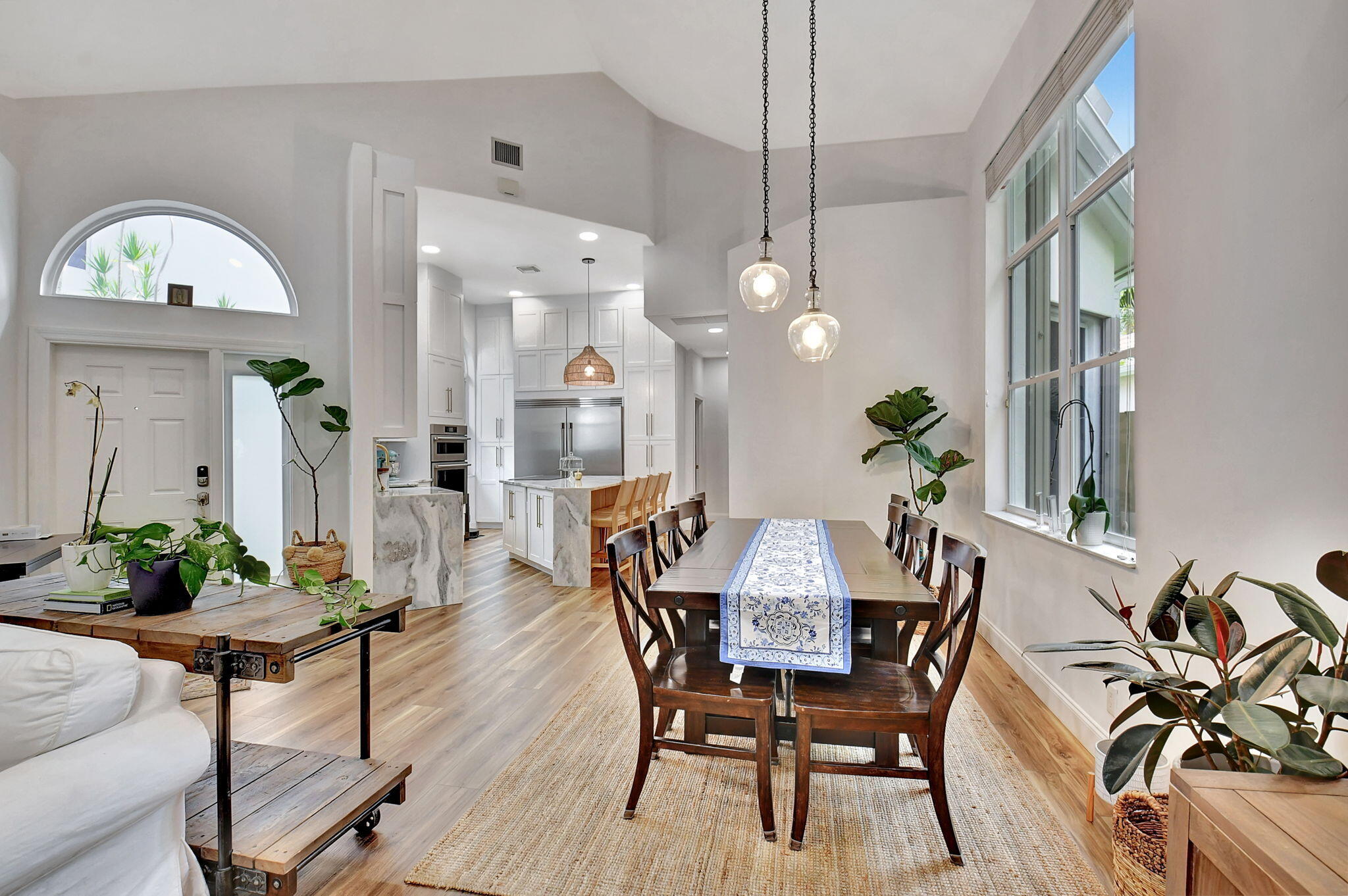 6623 Northwest 25th Avenue Boca Raton, FL 33496 - Photo 11 of 37 a view of a dining room with furniture and a chandelier
