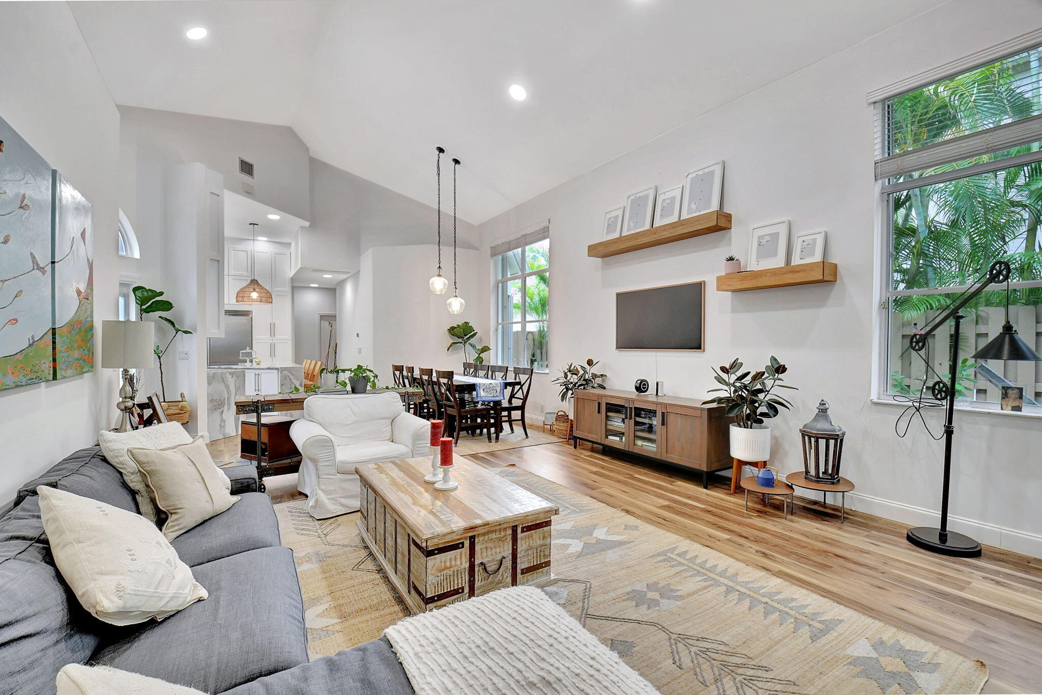 6623 Northwest 25th Avenue Boca Raton, FL 33496 - Photo 14 of 37 a living room with furniture a flat screen tv and a large window