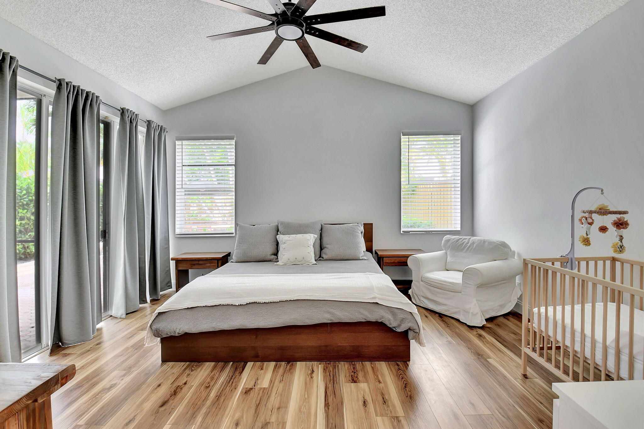 6623 Northwest 25th Avenue Boca Raton, FL 33496 - Photo 17 of 37 a bedroom with a bed and window