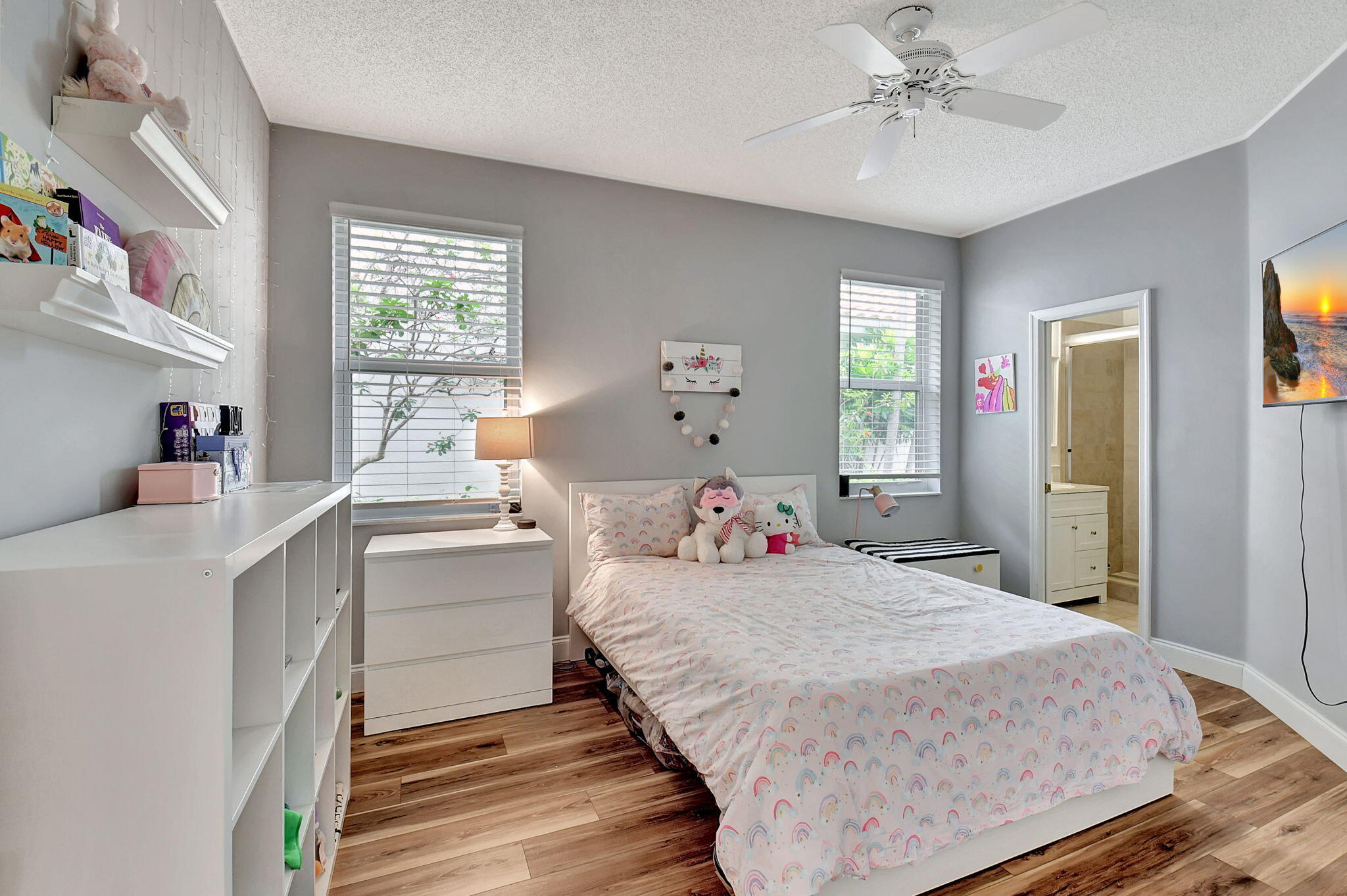 6623 Northwest 25th Avenue Boca Raton, FL 33496 - Photo 20 of 37 a bedroom with a bed and a chandelier